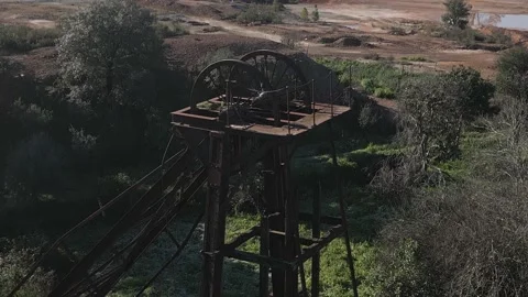 Drone shot of an old rusty elevator shaft in the ghost town of Sao Domingo Stock Footage 235351838