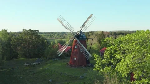 Drone shot of old windmill. Aerial view of aged red wind mill blades Netherlands Stock Footage 131222325