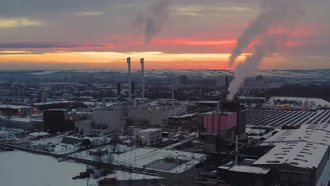 Drone Shot of Orange Sunset over Industrial Complex During Winter Stock Footage 159480011