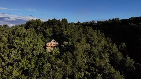 Drone Shot orbiting Cabin on Mountain Stock Footage 94136408
