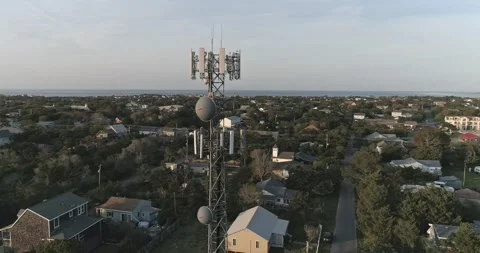 Drone shot orbiting of a cell tower on Ocracoke Island in the Outer Banks Stock Footage 239029913