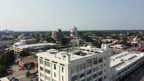 Drone Shot Orbiting Side Of Building With Water Tower On Top Stock Footage 161423502