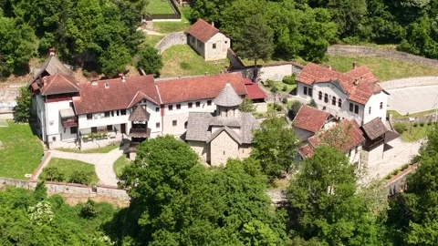 Drone Shot of Orthodox Monastery in Ovcar Banja, Serbia on Sunny Summer Day 動画素材 346357337