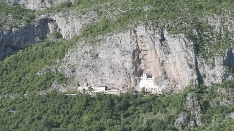 Drone Shot of Ostrog Monastery Built Into Cliffside, Montenegro Stock Footage 310335535