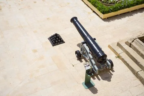 Drone shot over an ancient canon in Herbert Ganado Gardens, Malta Stock Photos