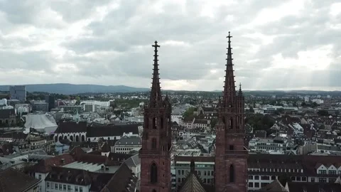 Drone shot over Basel Minster Cathedral spires Switzerland Clip 1 Stock Footage 140623336