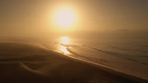 Drone shot over beach and ocean. Golden hour Stock Footage 106071470