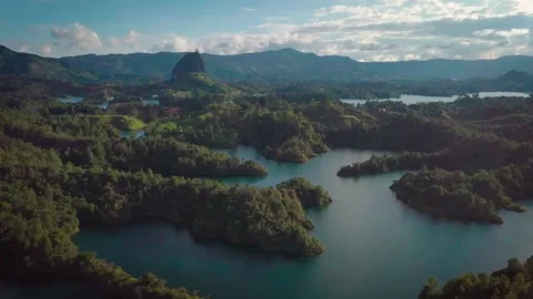 Drone shot over big boulder "El Peñol" and Guatapé lake Stock-Footage 162873331