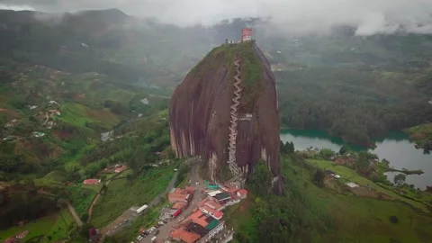 Drone shot over big boulder "El Peñol" &amp; Guatapé lake, Colombia Stock-Footage 162874617