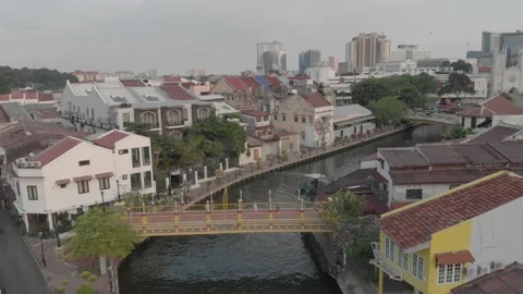 Drone shot over a bridge, melaka river in melaka city, malaysia Stock Footage 130294548