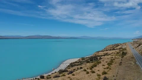 Drone shot over bright blue Lake Pukaki in New Zealand Stock Footage 169829298