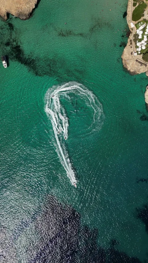Drone Shot over Cala Murada with cenital view of Watersky, Mallorca, Spain Stock Footage 254572949