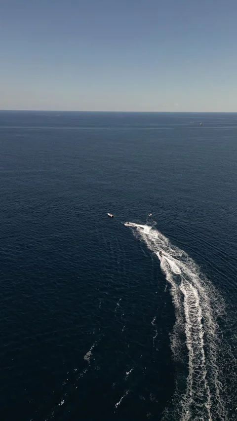 Drone Shot over Cala Murada with cenital view of Watersky, Mallorca, Spain Stock Footage 254581115