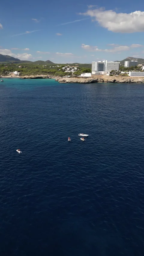 Drone Shot over Cala Murada with cenital view of Watersky, Mallorca, Spain Stock Footage 254581546