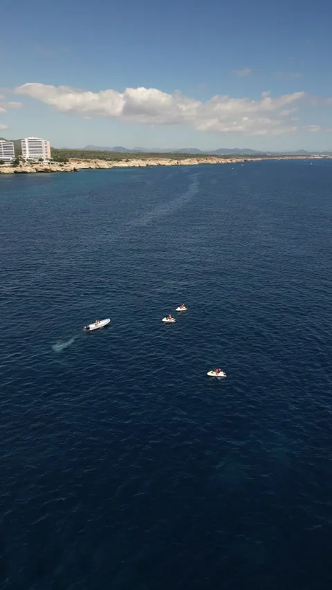 Drone Shot over Cala Murada with cenital view of Watersky, Mallorca, Spain Stock Footage 254624490