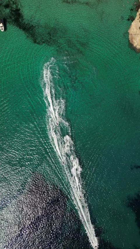 Drone Shot over Cala Murada with cenital view of Watersky, Mallorca, Spain Stock Footage 254780054
