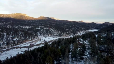 Drone shot over chalets in small Colorado Rocky Mountain town Stock Footage 261590042