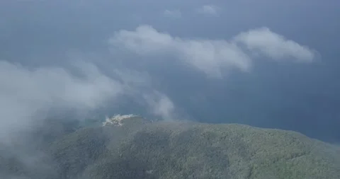 Drone shot over the clouds at the coast of tuscany 動画素材 164302144