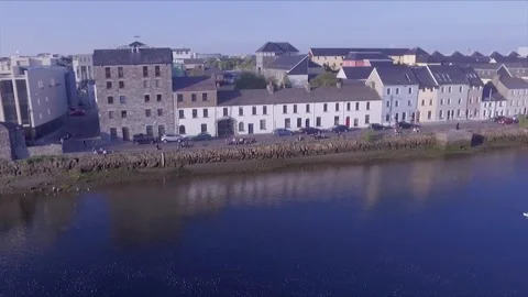 Drone Shot over Corrib River Showing The Long Walk in Galway City with Stock Footage 132809625