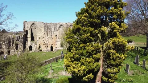 Drone shot up over Easby Abbey revealing Richmond Stock Footage 220032167