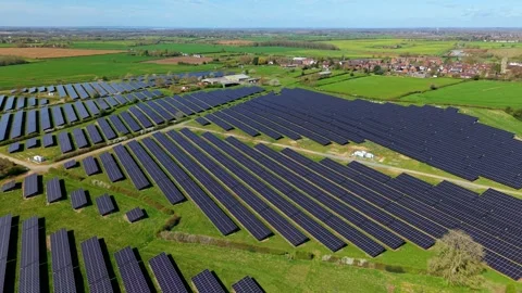 Drone Shot Over Expansive Solar PV Energy Array Across Countryside Fields 库存影片 343920837