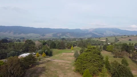 Drone Shot over Golf Course towards Kaimai Ranges Stock Footage 197019802