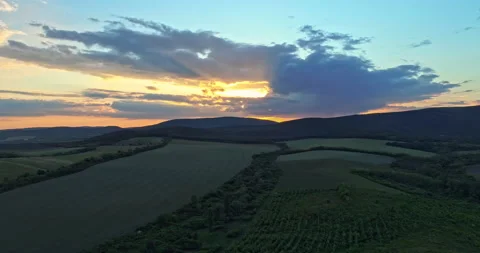 Drone shot over green meadows before sunset in Hungary Stock Footage 139877559