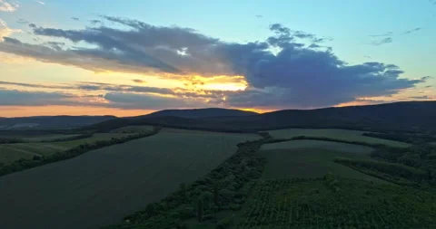 Drone shot over green meadows before sunset in Hungary Stock Footage 139877589