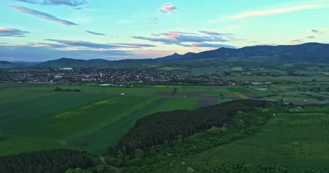 Drone shot over green meadows before sunset in Hungary Stock Footage 139877649