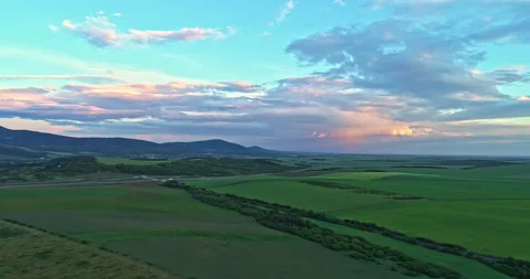Drone shot over green meadows before sunset in Hungary Stock Footage 139877706