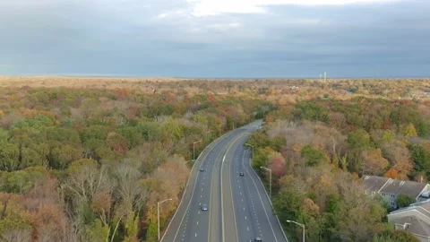 Drone shot over Highway I95 during Fall season in New England - Connecticut Stock Footage