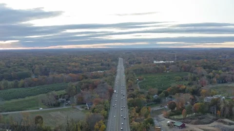 Drone shot over Highway I95 during Fall season in New England - Connecticut Stock Footage 142530156