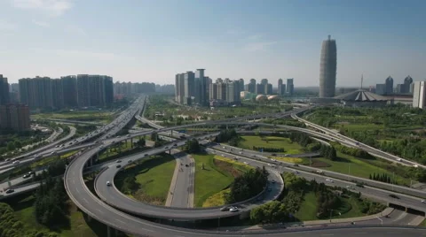 Drone shot over major intersection and modern Zhengzhou skyline Stock-Footage 67538832