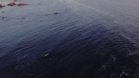 Drone shot over Malibu beach rocks by the ocean Rec709 Stock Footage 84550431