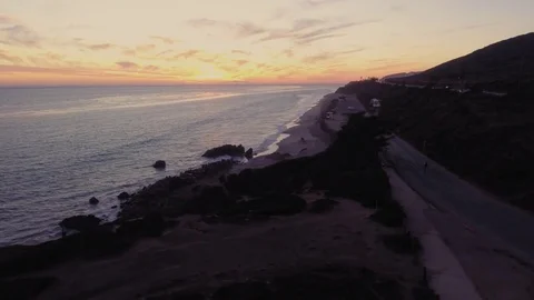 Drone shot over Malibu beach rocks by the ocean Rec709 Stock Footage 84554671