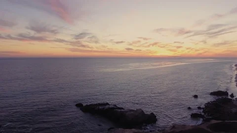 Drone shot over Malibu beach rocks by the ocean Rec709 Stock Footage 84555737