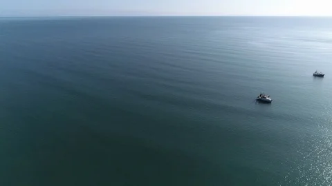 Drone Shot Over Ocean and Fishing Boats Stock Footage