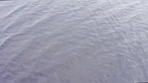 Drone shot over ocean to Toe Hill Stockbeeldmateriaal 158509479