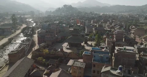 Drone Shot Over the Old Town of Panauti Surrounded by Nature Stock Footage 319477058