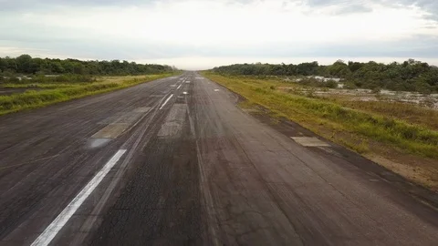 Drone shot over a pilot preparing to take off on a paramotor glider. Stock Footage 111150364