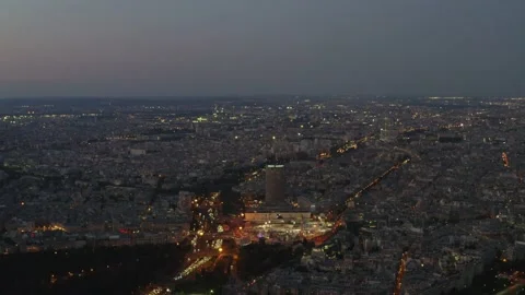 Drone shot over ring road around densely populated city Paris at night Stock Footage 162404284