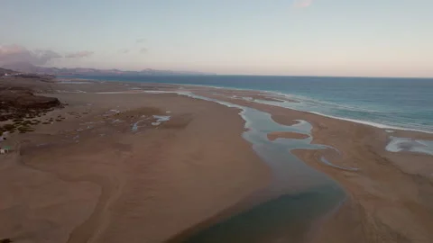 Drone Shot Over Risco del Paso and Sotavento Beach During Golden Hour Stock Footage 309691283