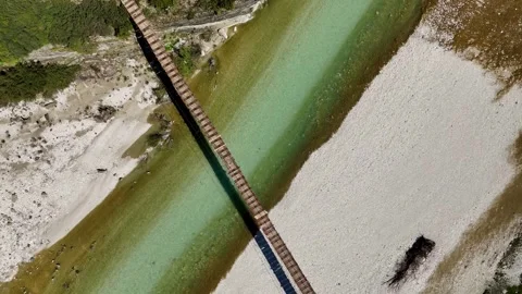 Drone Shot Over River with Bridge in Scenic Mountain Valley Stock Footage 332059614
