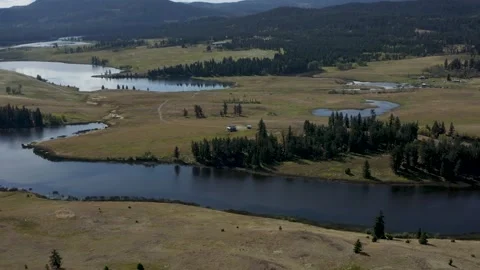 Drone Shot Over River Into Rolling Hills Video stock 157511812