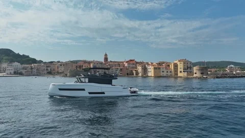Drone Shot Over Saint-Tropez Bell Tower Leading to Sea and Yachts – 4K Video stock 303289045