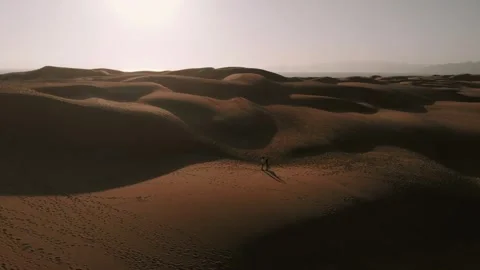 Drone shot over  sand dunes at sunset Stock Footage 241362625