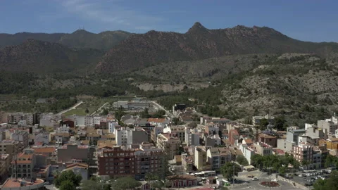 Drone shot over sea front town leading towards the mountains view Stock-Footage 150404413