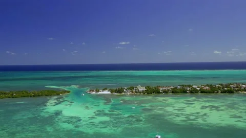 Drone shot over the split lagoon at the Caye Caulker island, Belize Stock Footage 231431800