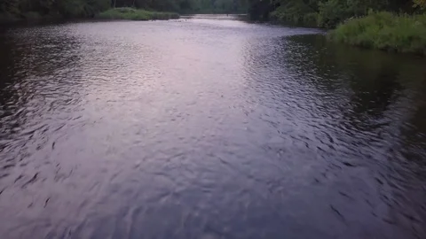 Drone Shot over Stream Fly Fisherman Evening Stock Footage 129456959