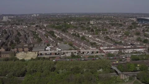 Drone shot over Tottenham Hale neighborhood including modern high and low rise 스톡 동영상 284248347